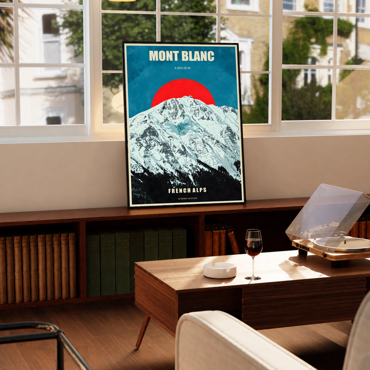 Mont Blanc poster in a slim dark frame, showing snowy peaks beneath a red sun