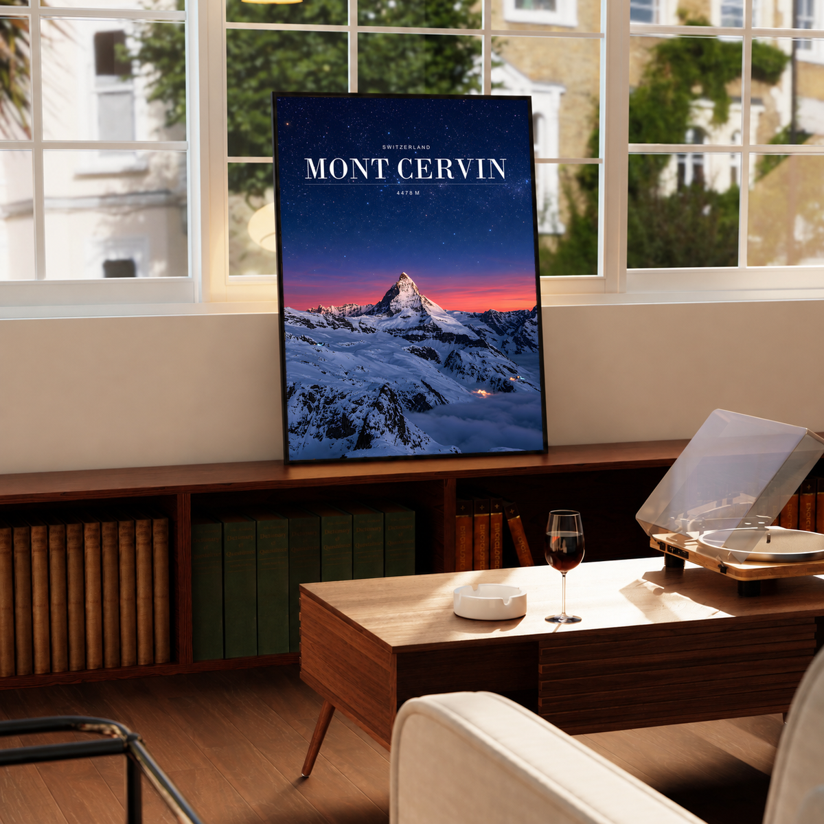 Snowy Mont Cervin beneath a starry navy sky and pink horizon; framed print beside a window