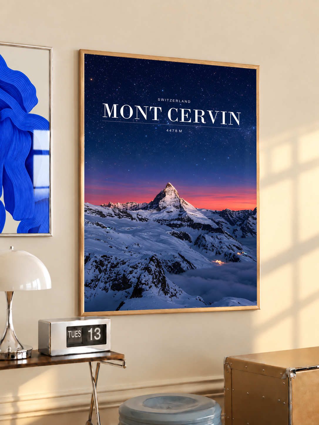 Snowy Mont Cervin beneath a starry navy sky and pink horizon; oak framed print in a desk setting