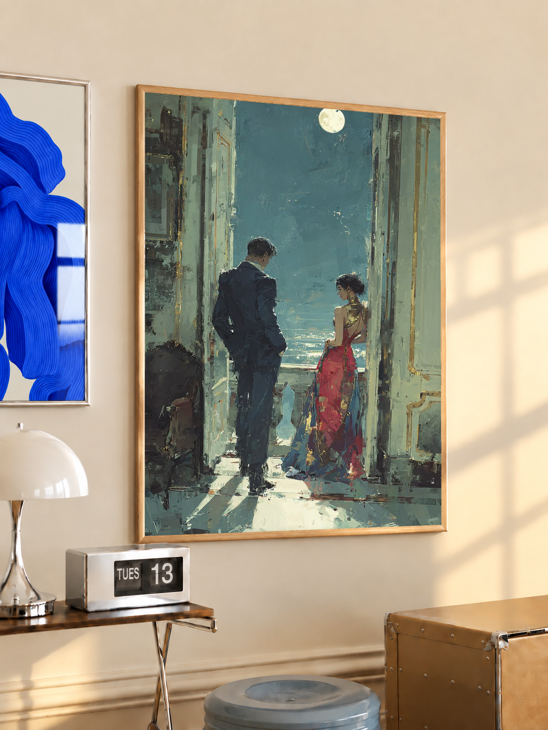Framed couple art print with teal doors, dark jacket figure, and red dress under moonlight.