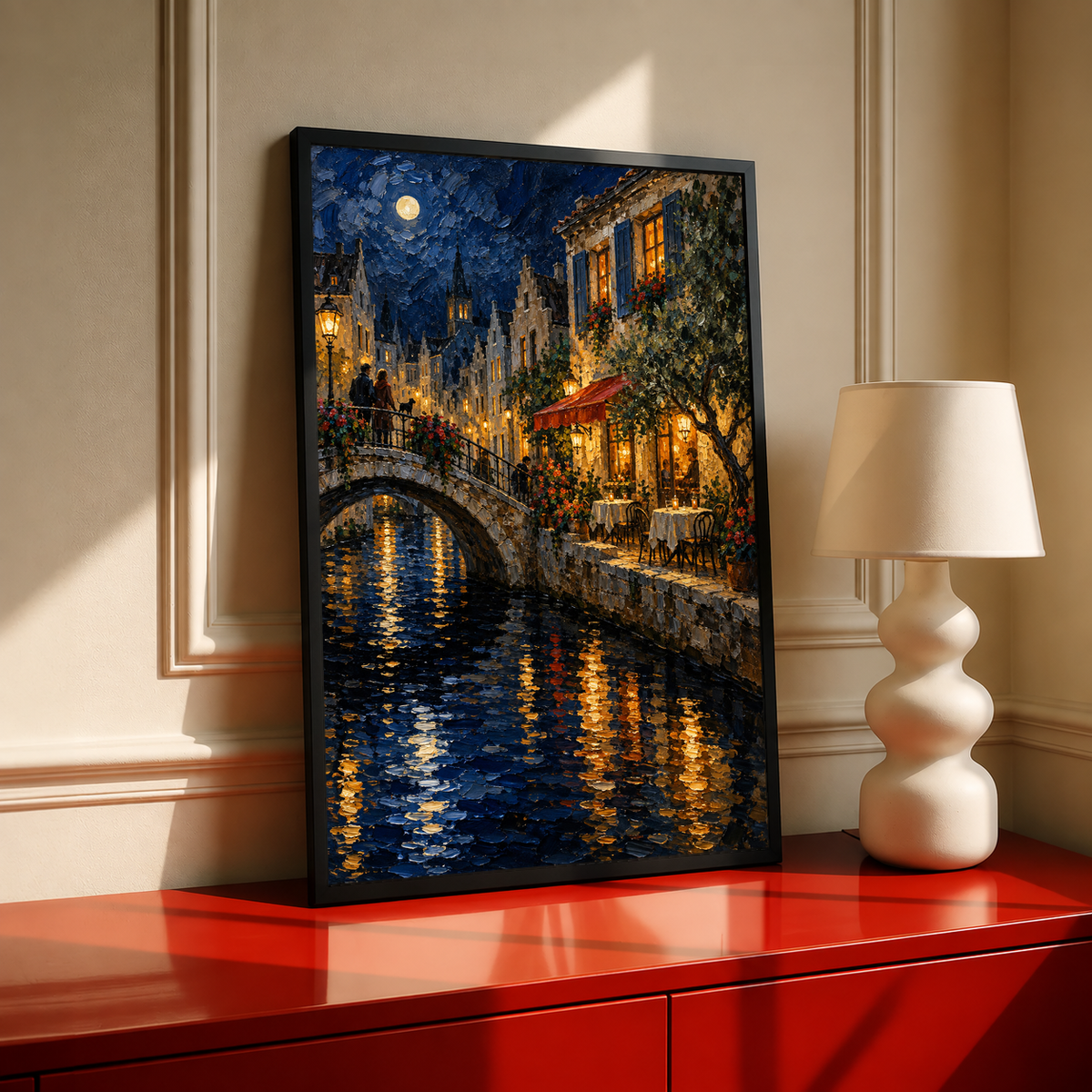 Black-framed night canal print with arched bridge, golden window glow, and mirror-like water