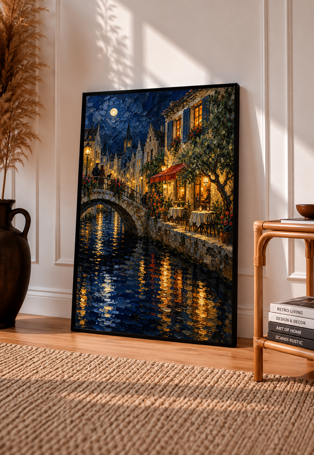 Black-framed wall art print of moonlit canal bridge with glowing windows and water reflections