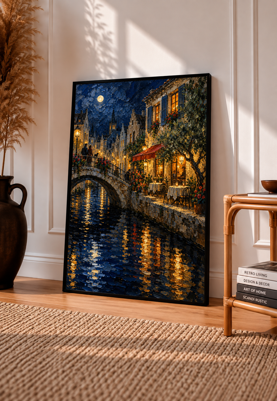 Black-framed wall art print of moonlit canal bridge with glowing windows and water reflections