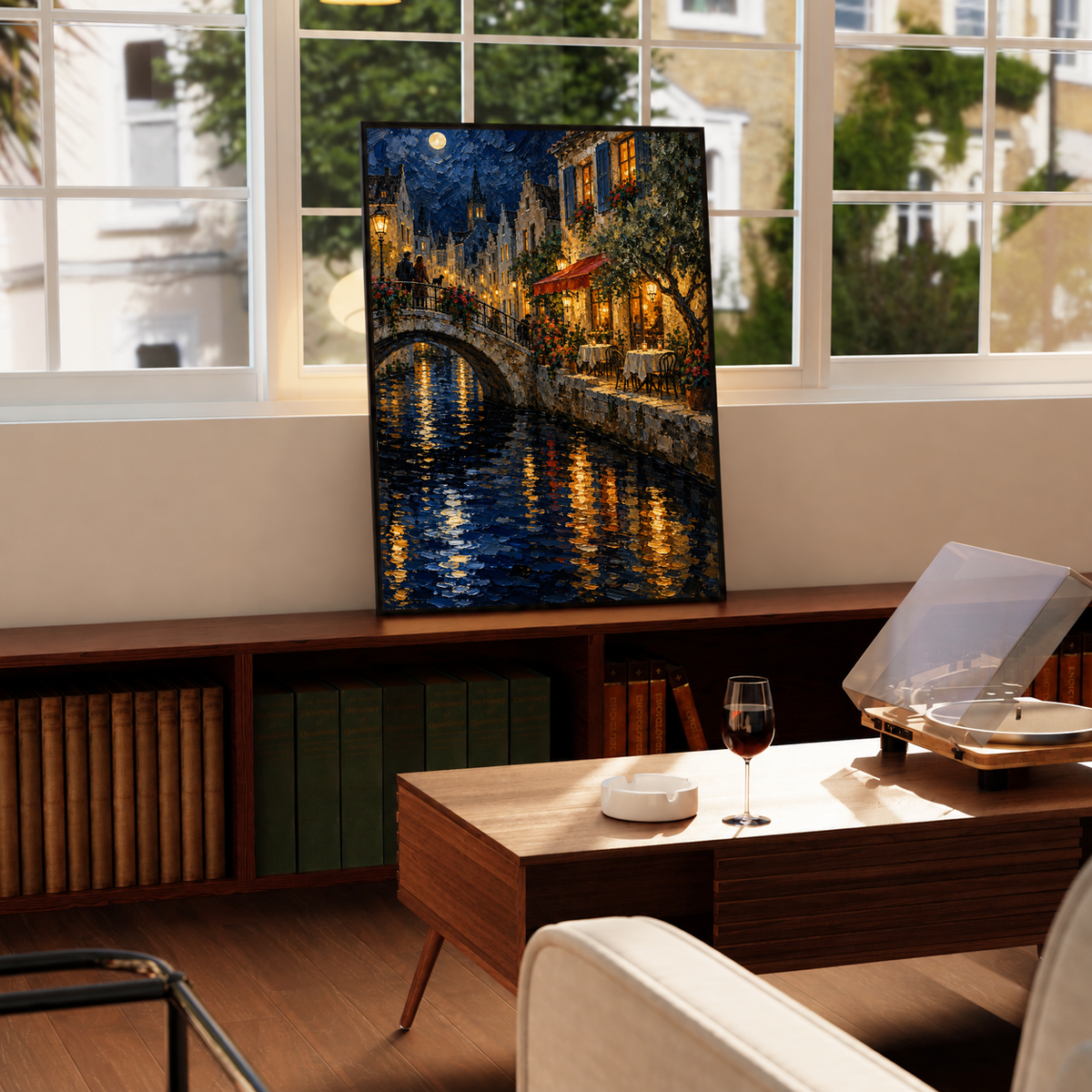 Black-framed street canal print with moonlit arch bridge, illuminated windows, and reflections