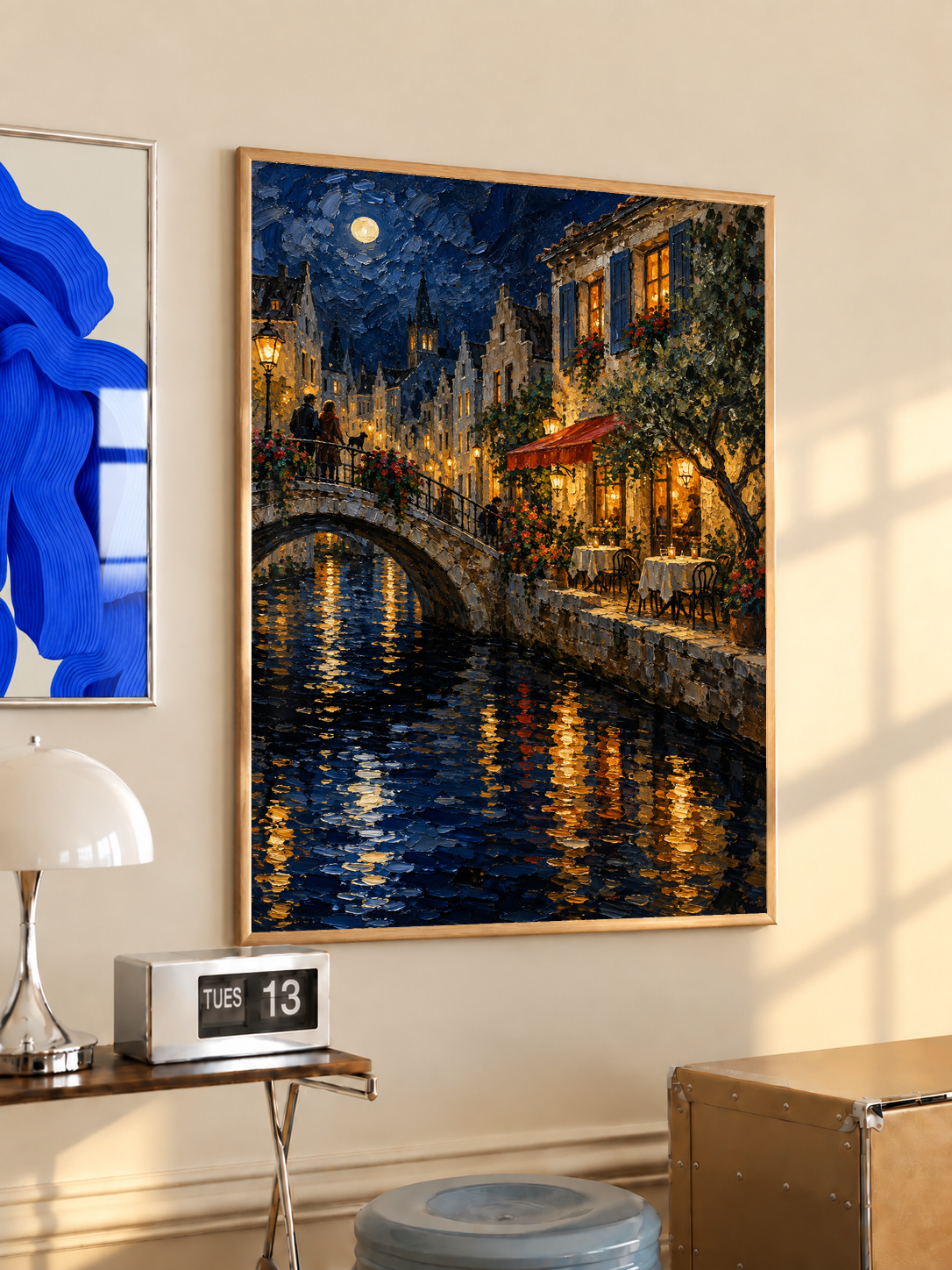 Black-framed canal bridge print with moonlight sky, warm window lights, and rippling reflections