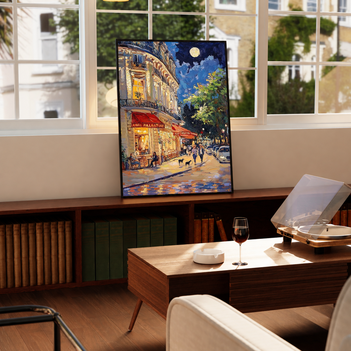 Black-framed Moonlit French Café print with red awnings and glowing corner building