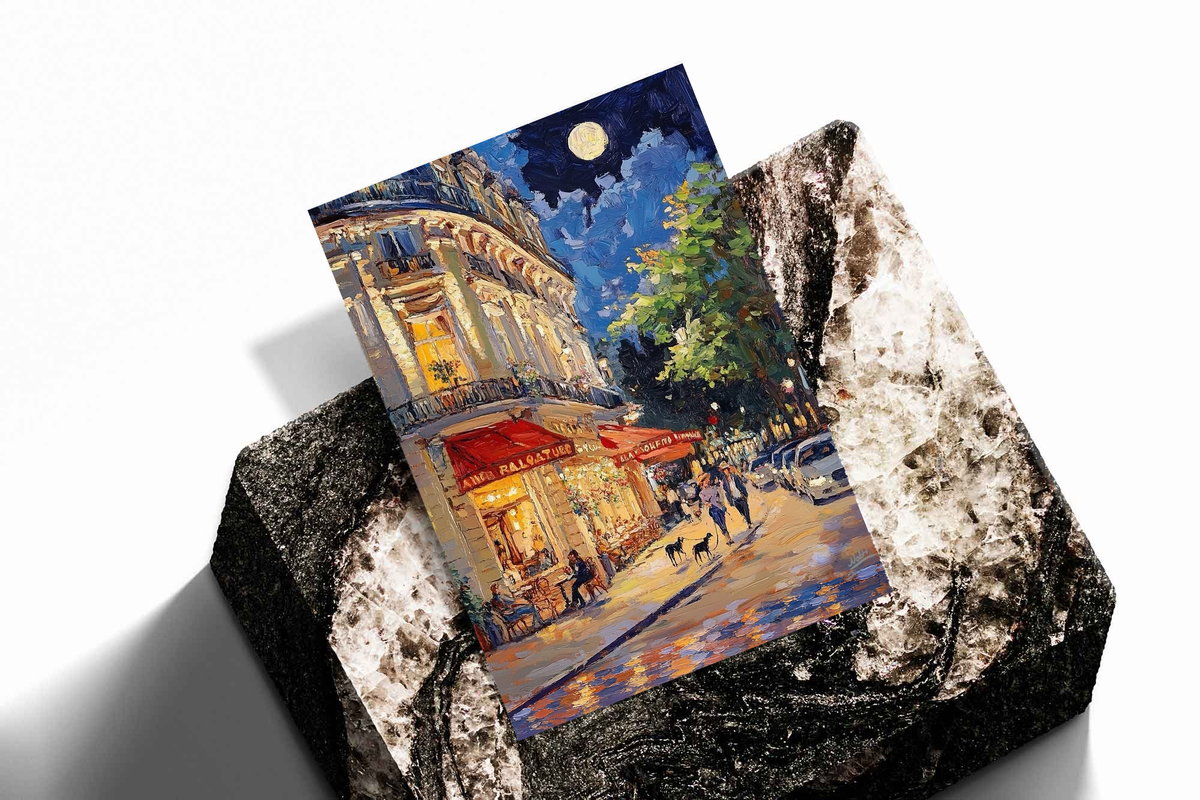 Moonlit French café print with red awnings, shown on a textured display block