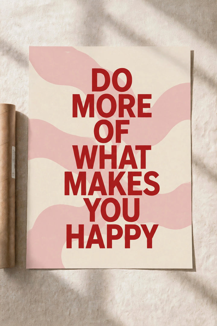 Motivational poster with red quote 'Do more of what makes you happy' on pale pink