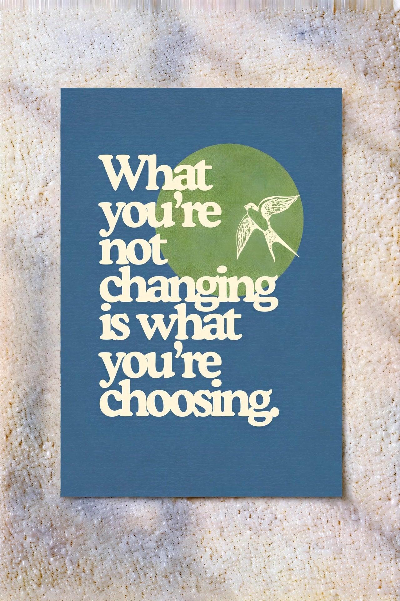 Blue typography wall poster with white quote text and green hummingbird icon