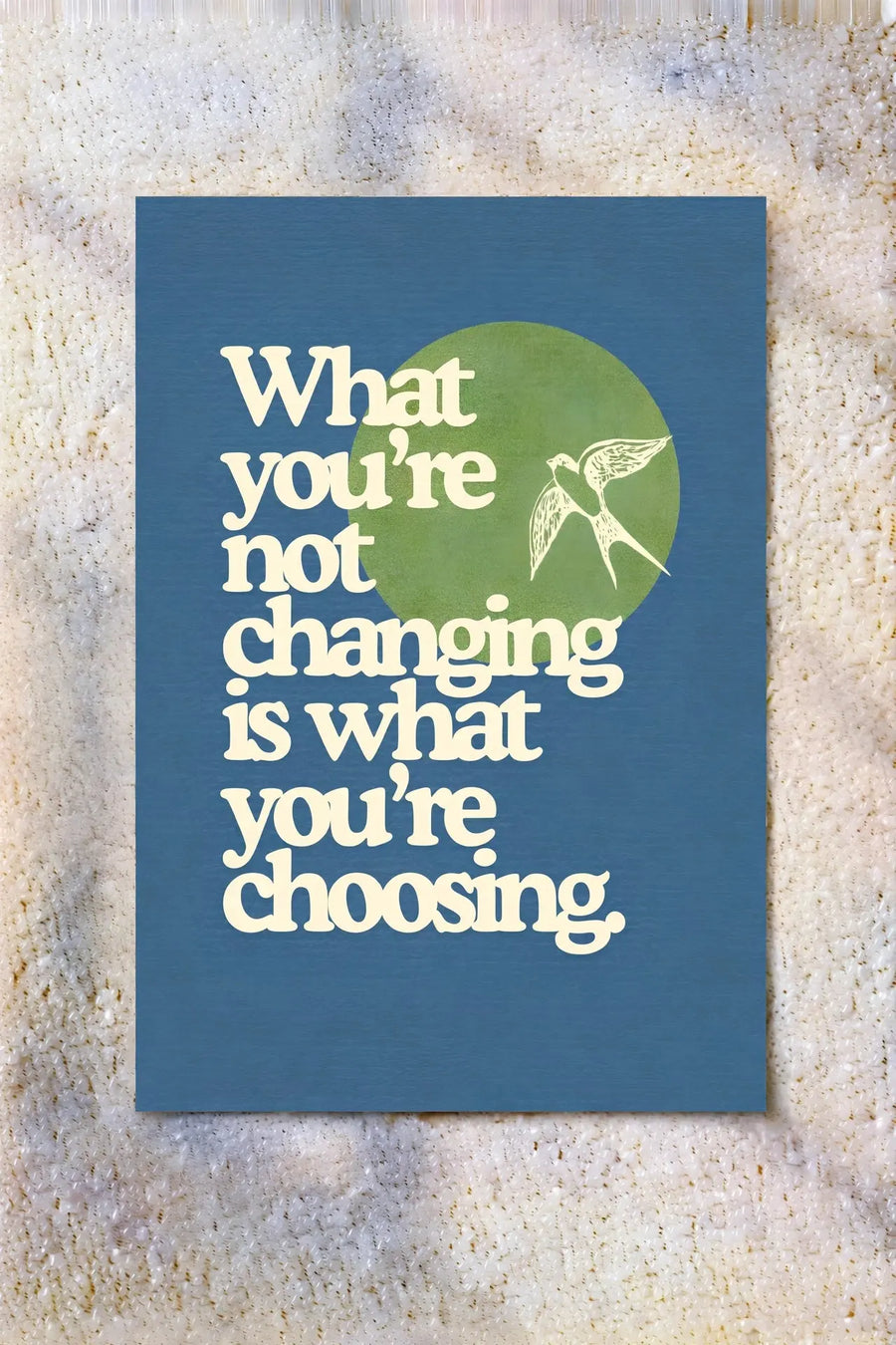 Blue typography wall poster with white quote text and green hummingbird icon