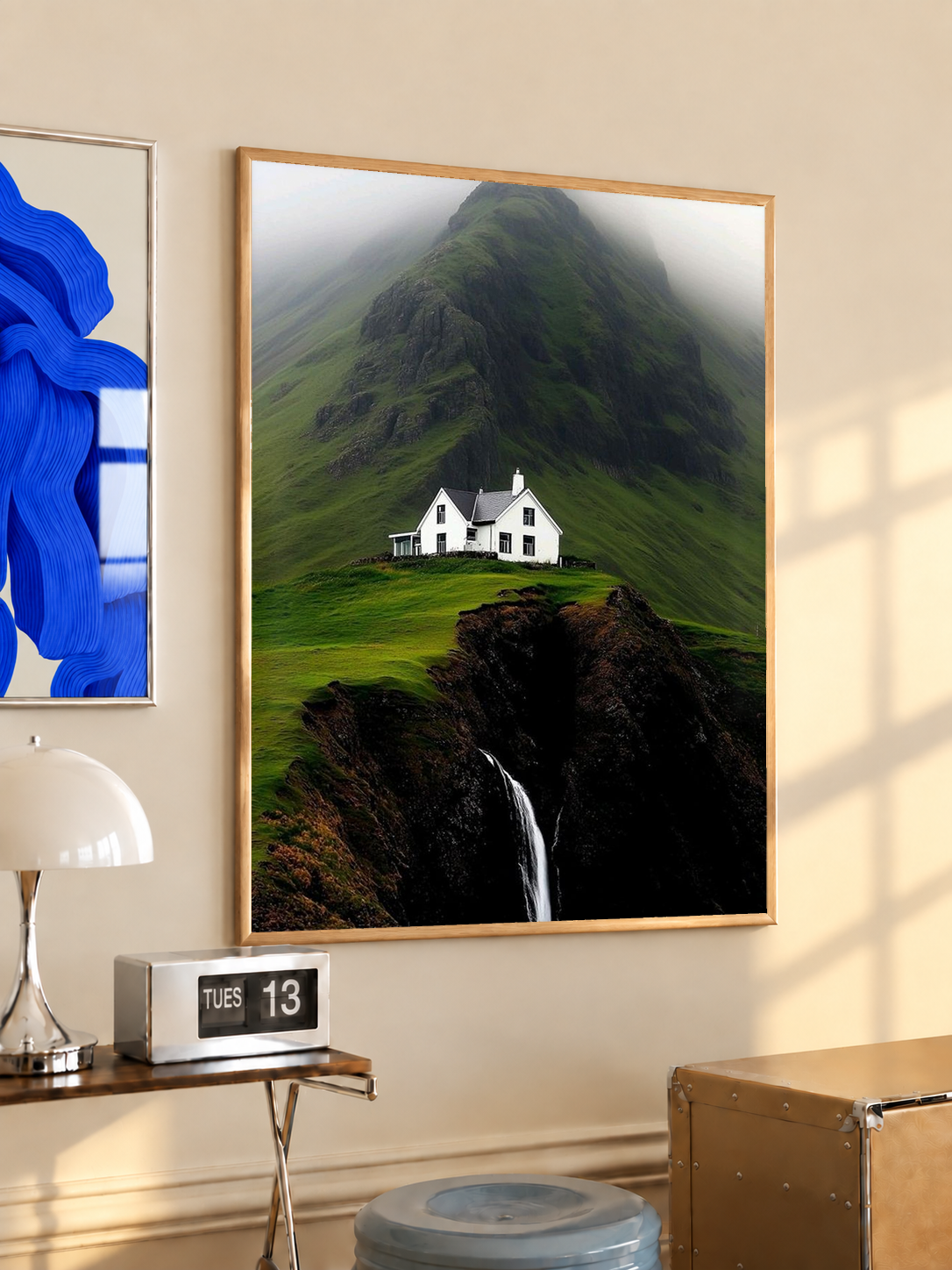 Oak-framed art print of misty green mountain with cottage and waterfall