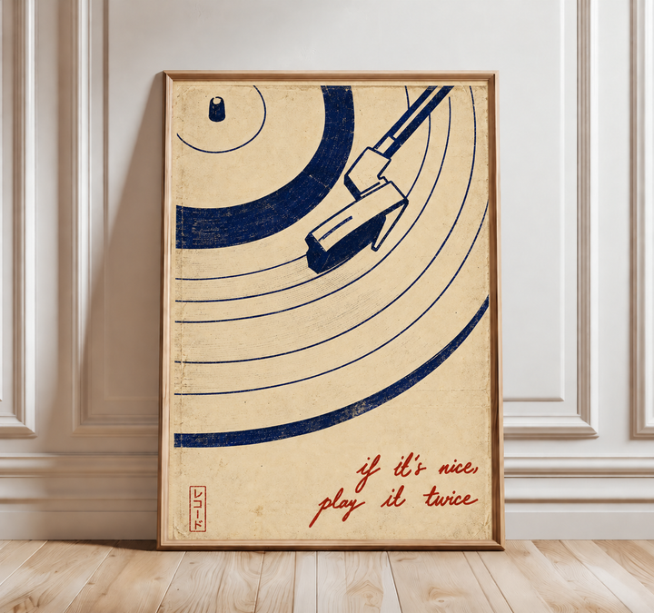 Vinyl record, tonearm and play-it-twice quote wall art displayed in styled interior view 3