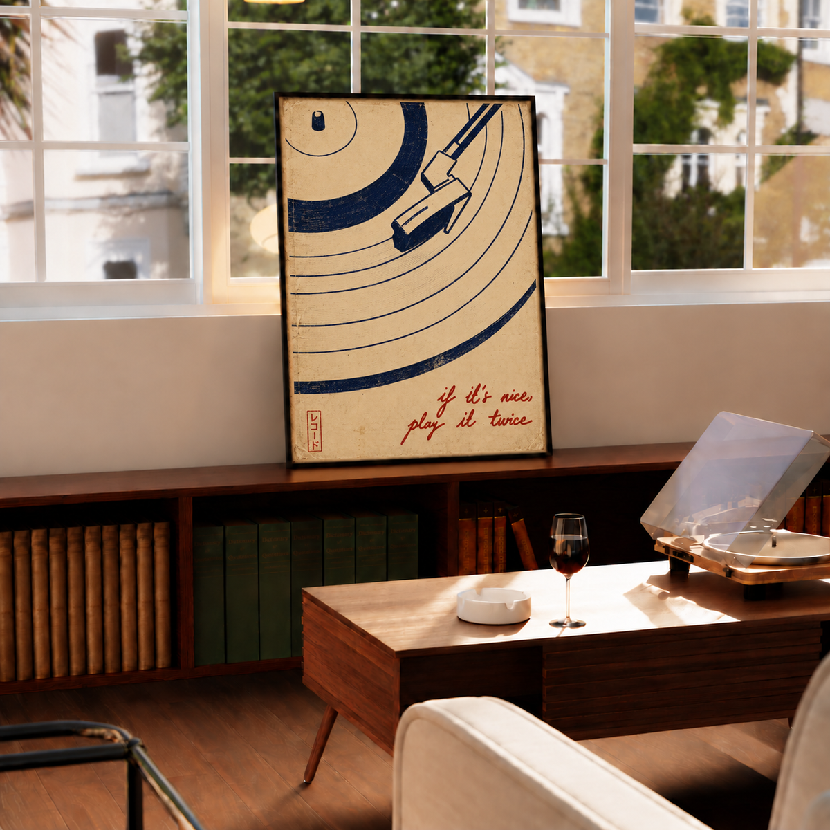 Vinyl record, tonearm and play-it-twice quote wall art displayed in styled interior view 4