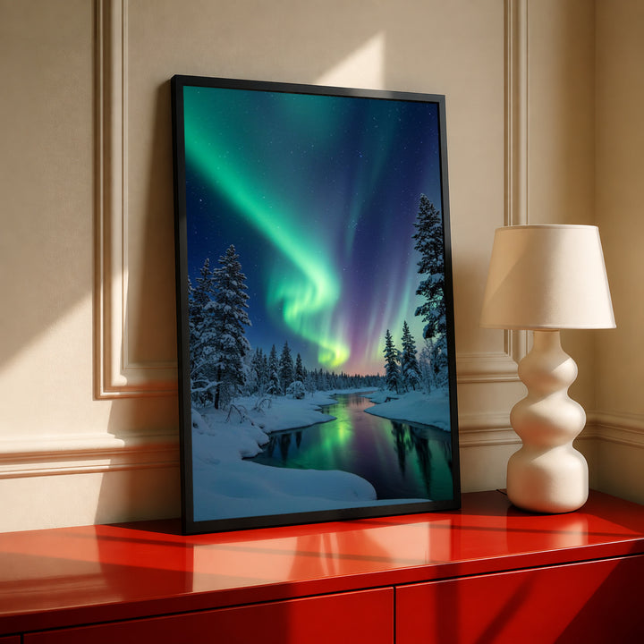 Framed landscape wall art with green aurora above snowy pines and reflective river
