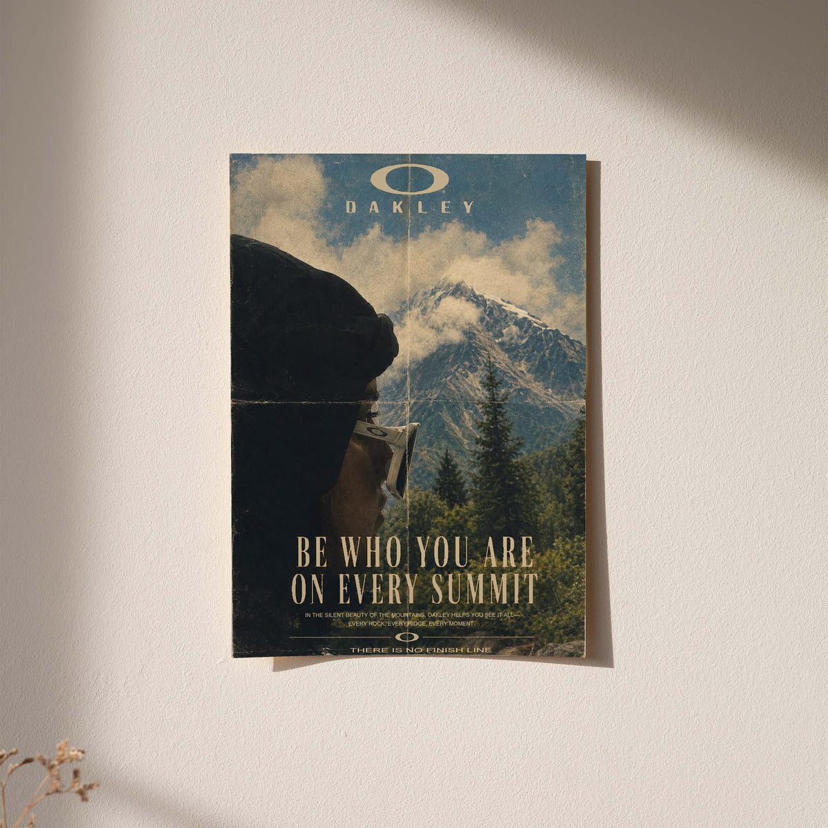 Framed blue mountain poster with Oakley logo and gold "Be who you are on every summit"