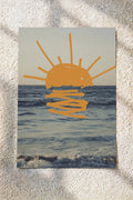Ocean wall art poster with orange sun over blue waves and simple line waves