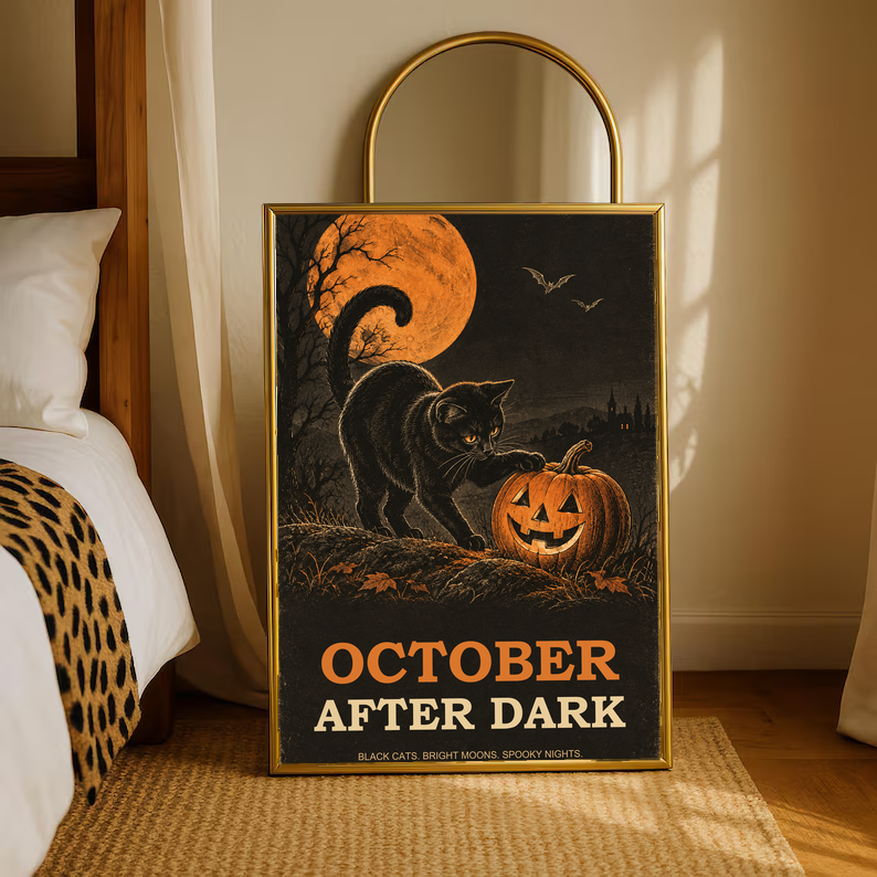 Gold-framed Halloween poster with black cat, orange moon, jack-o'-lantern, bats, 'OCTOBER AFTER DARK'.