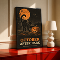 Framed Halloween poster: black cat with orange moon, jack-o'-lantern, bats, 'OCTOBER AFTER DARK'.
