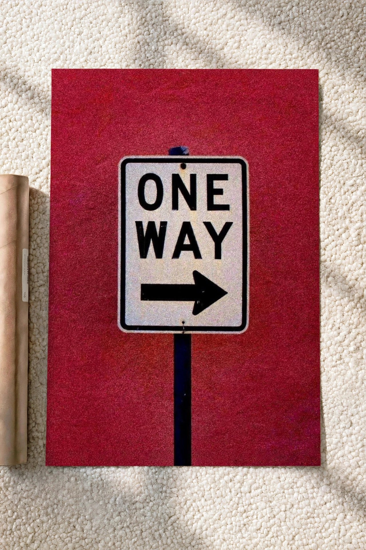 One way poster with red background and sign reading ONE WAY with right arrow