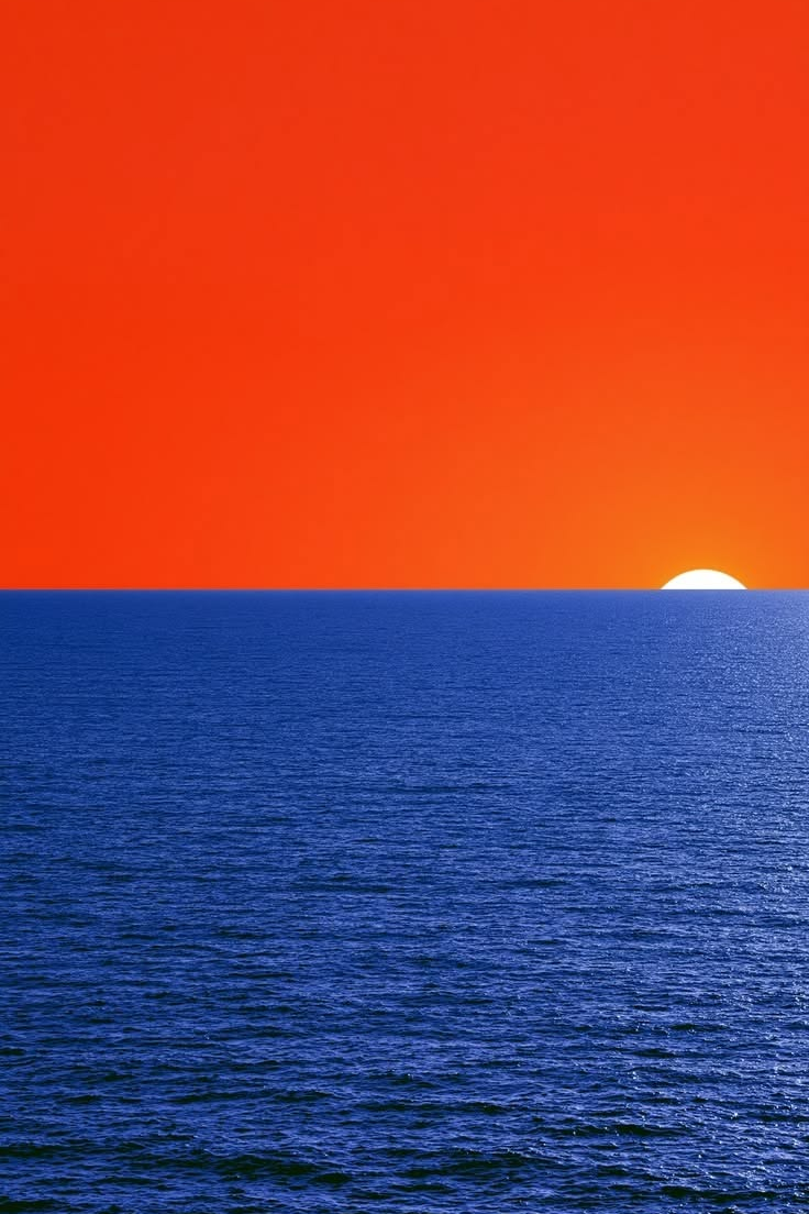 Orange and blue ocean sunset landscape print with bright orange sky and blue sea