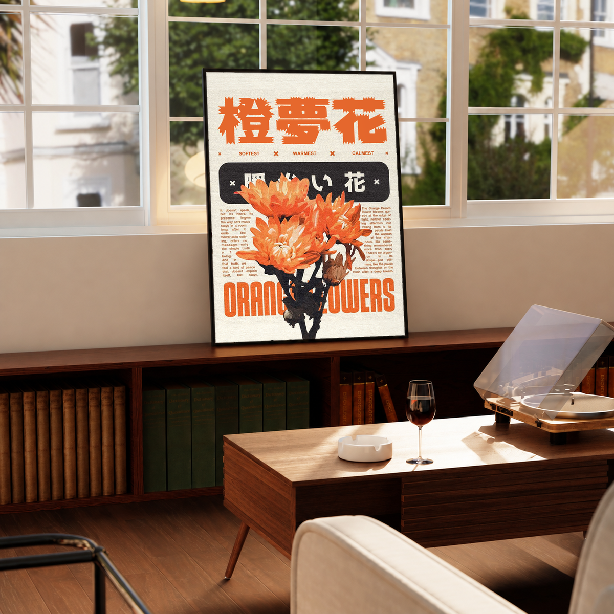 Orange flower Japanese graphic poster on cream paper with black text, black frame on display