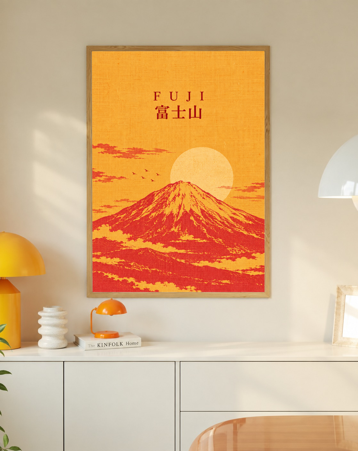 Framed Mount Fuji sunrise print with “FUJI” text, orange sky, and large circular sun.