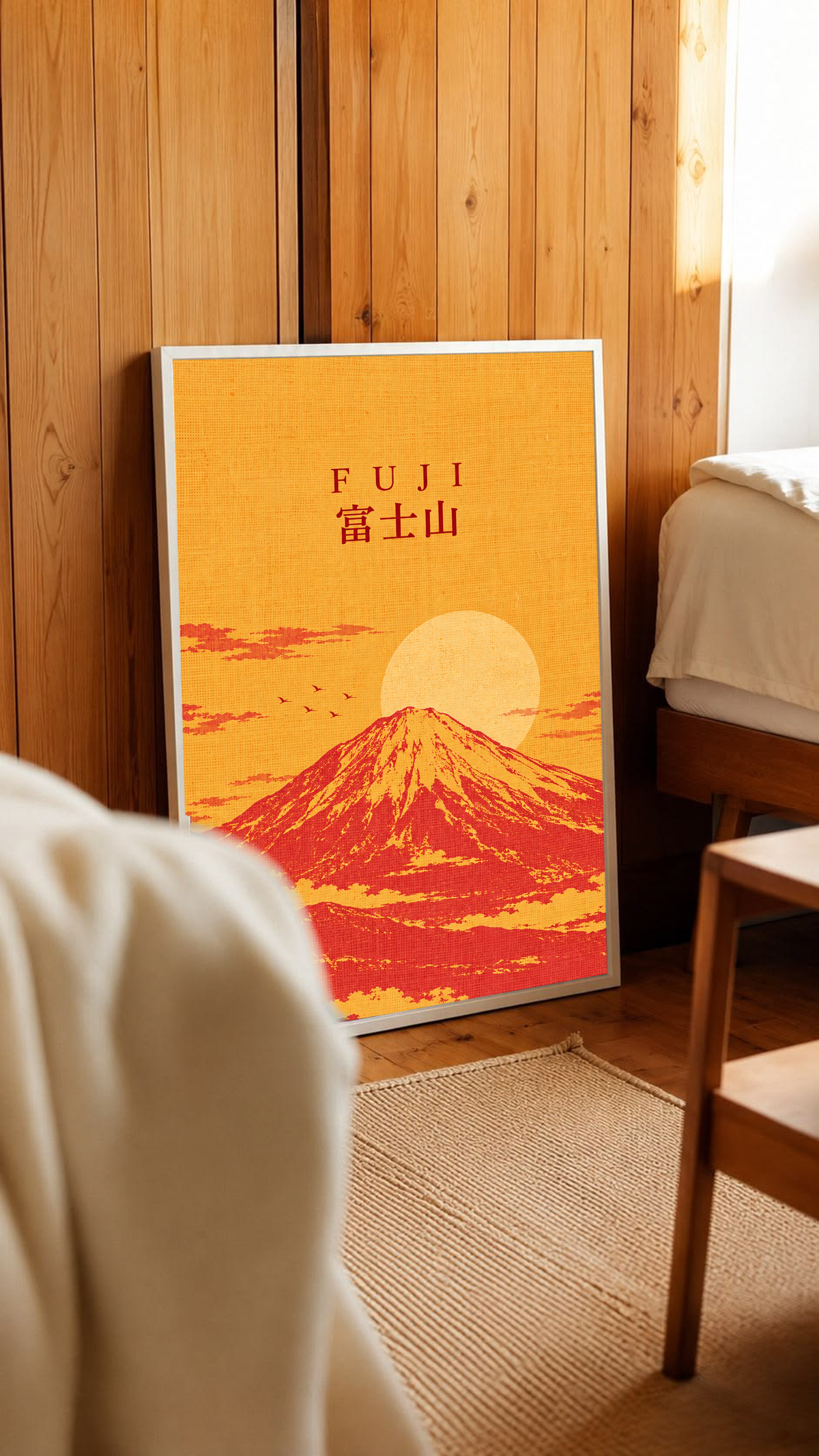 Light wood framed Mount Fuji sunrise poster with “FUJI” title and red mountain.