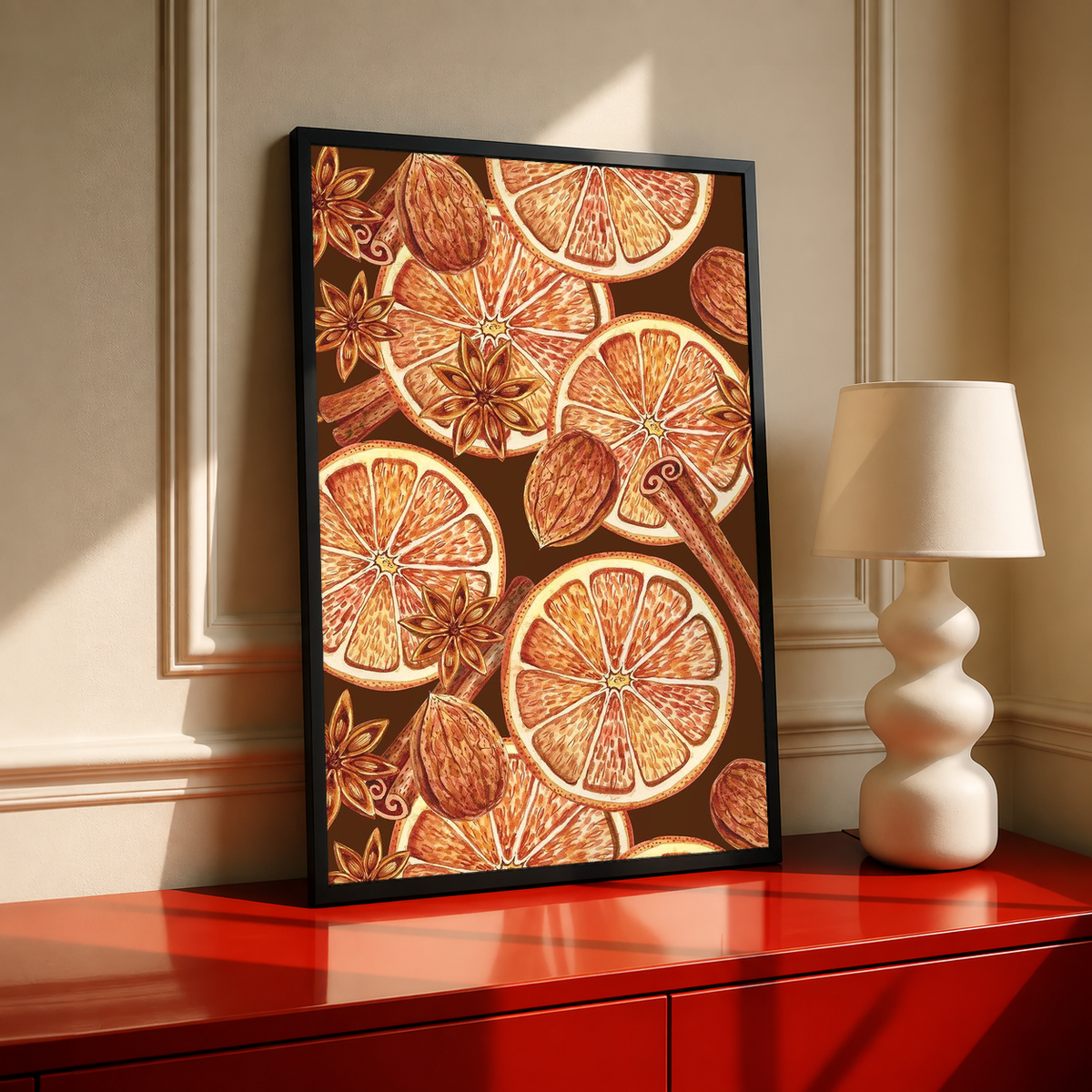 Black-framed art print of orange slices, spices, and star anise