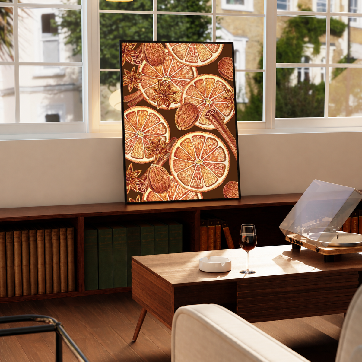 Tall art print with orange slices and star anise, in black frame
