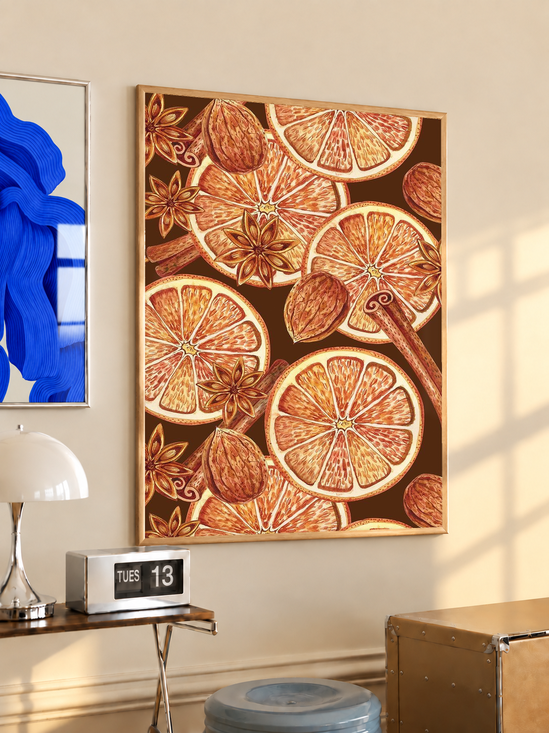 Black-framed art print with orange slice and spice pattern
