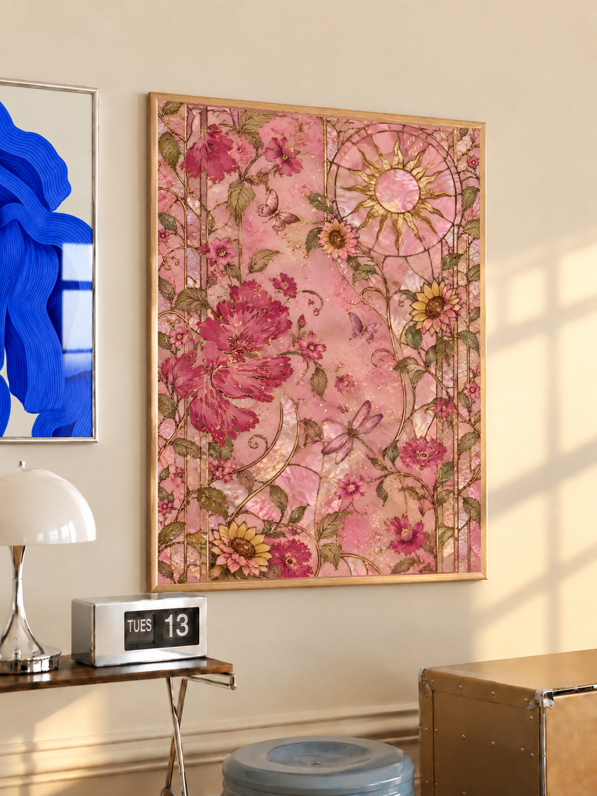 Framed pink floral wall art with ornate leaves, blooms, and a circular medallion