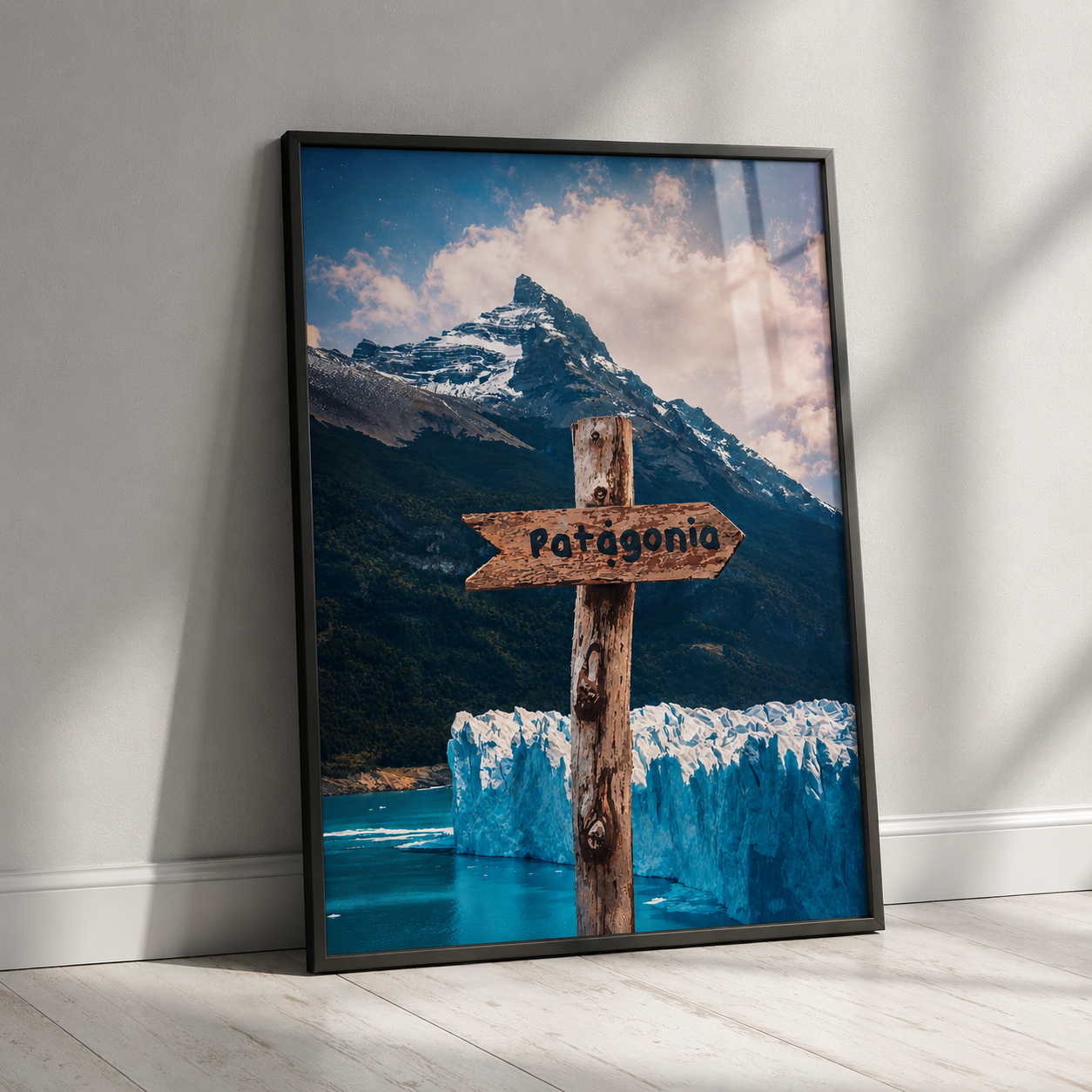 Black-framed travel poster with glacier mountain landscape and wooden Patagonia sign