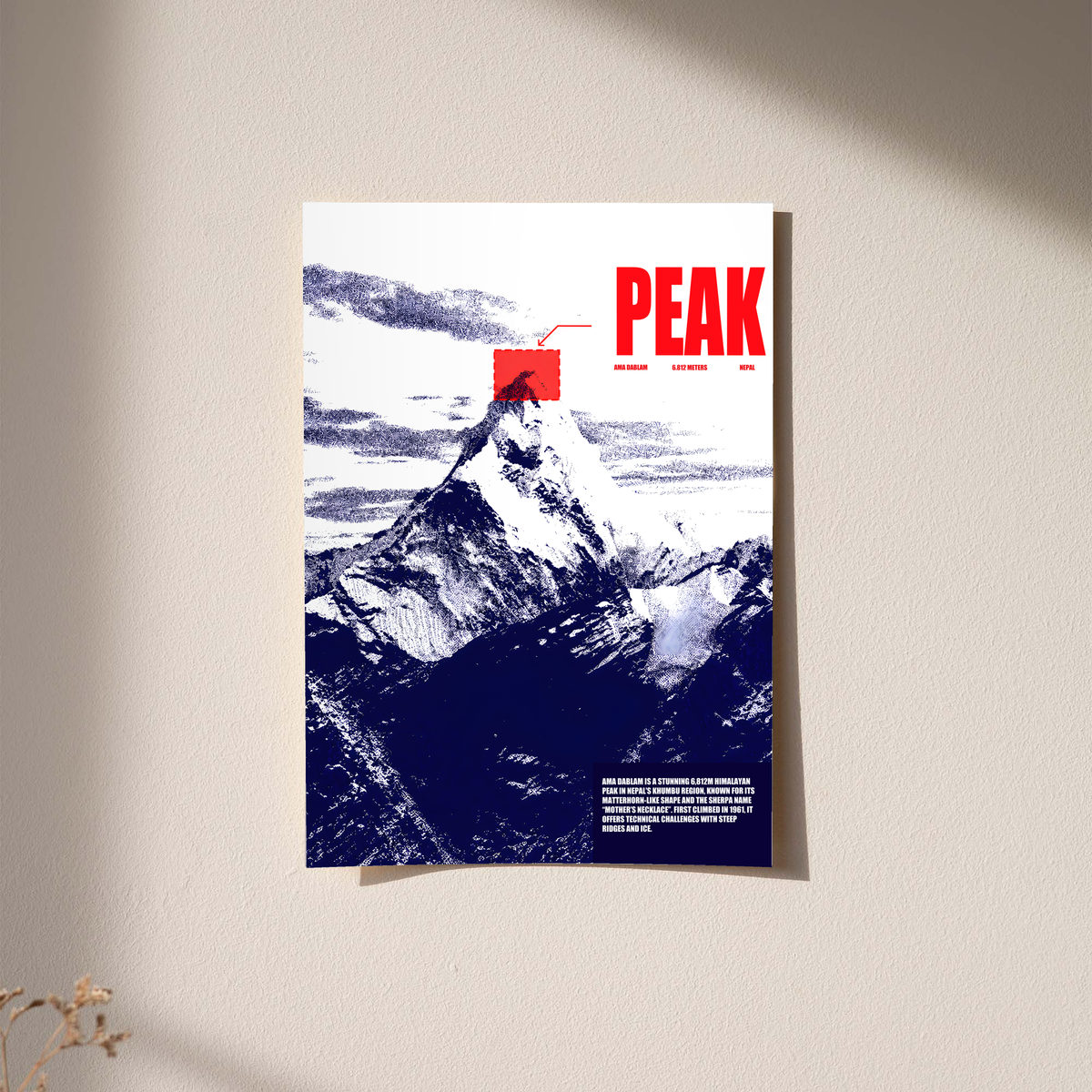 White and navy halftone Ama Dablam mountain with red PEAK lettering; unframed print on a wall
