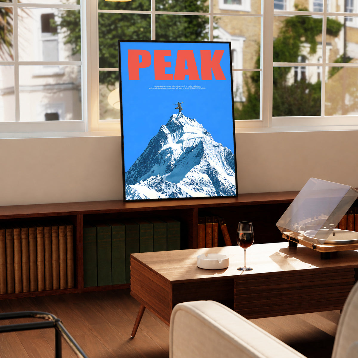 Peak Mountain Climber poster with bold red lettering, a blue field, and a snow-covered peak