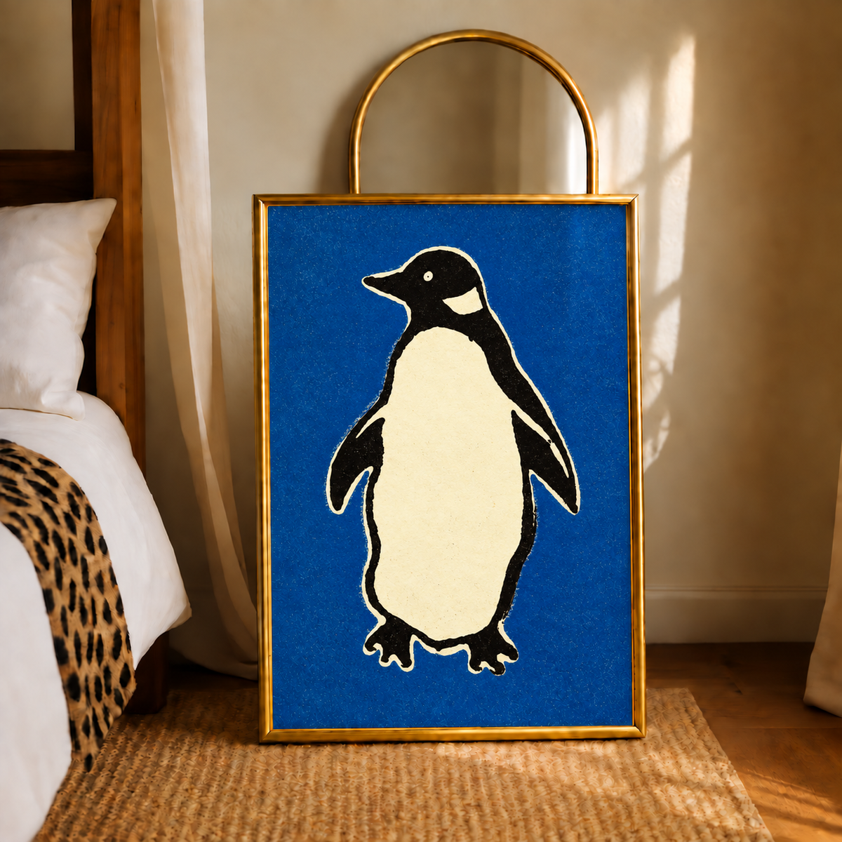 Framed penguin wall art with blue background, white and black penguin, gold border