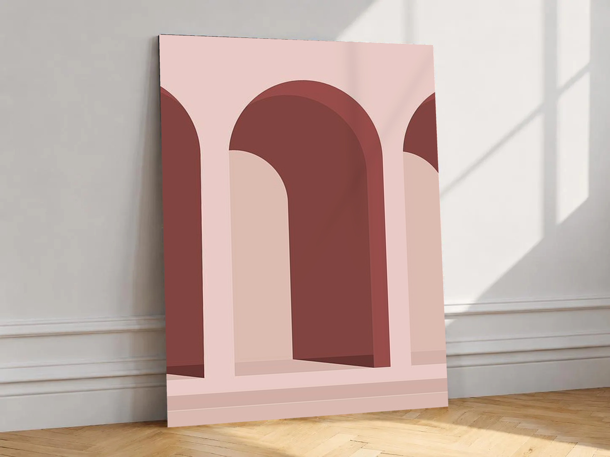 Canvas artwork depicting repeating arches and stair-like forms, leaning against a white wall in angled sunlight.