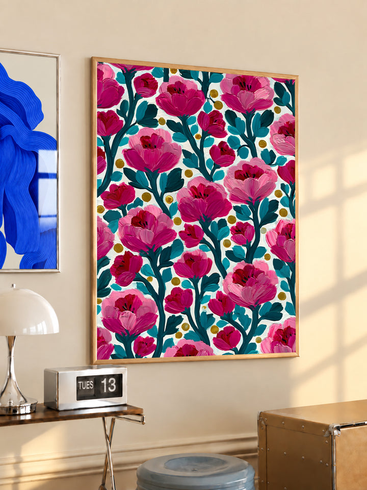 Framed floral wall art print with pink flowers, teal branches, cream background, and yellow dots
