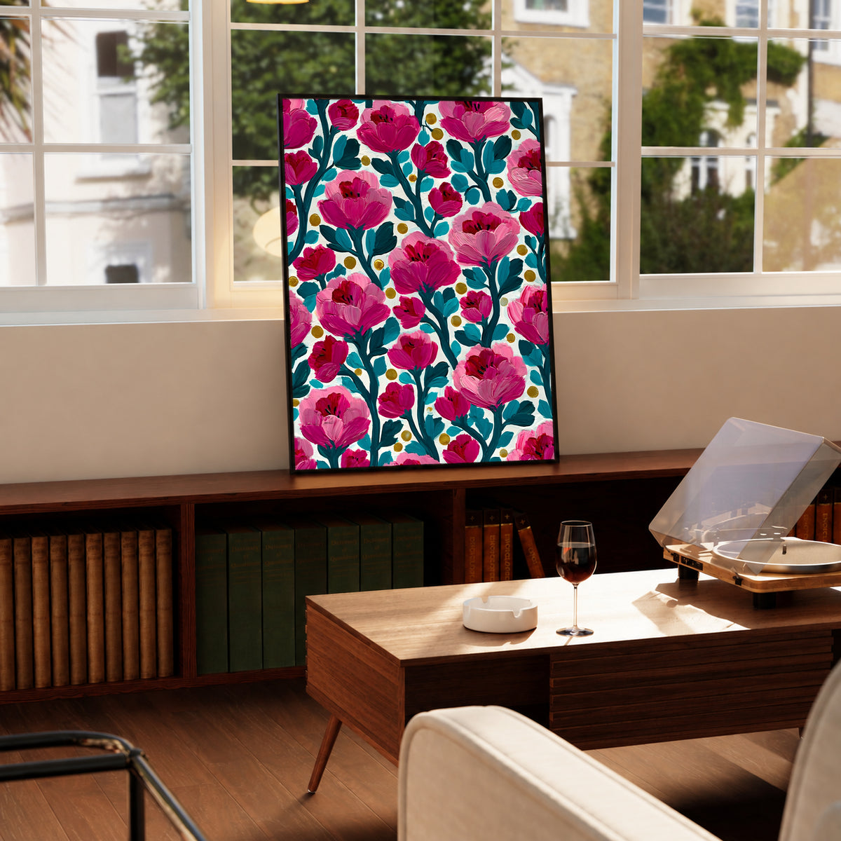 Framed floral wall art print with pink blossoms, teal stems, cream background, and yellow dot details