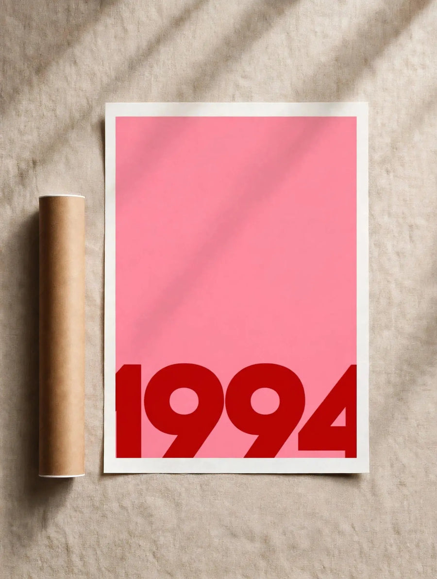 White-framed wall art poster with pink background and bold red '1994' typography
