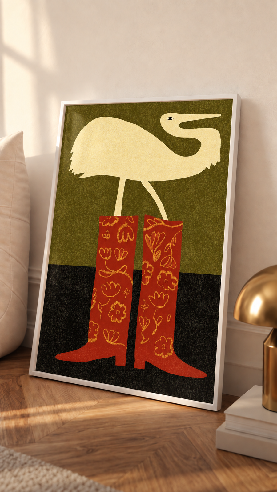 White-framed crane and cowboy boots wall art print with cream bird and red patterned boots