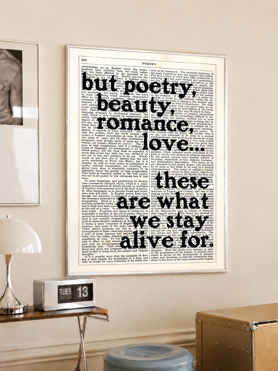 Framed poetry quote poster with bold black typography on cream background: 'but poetry...'