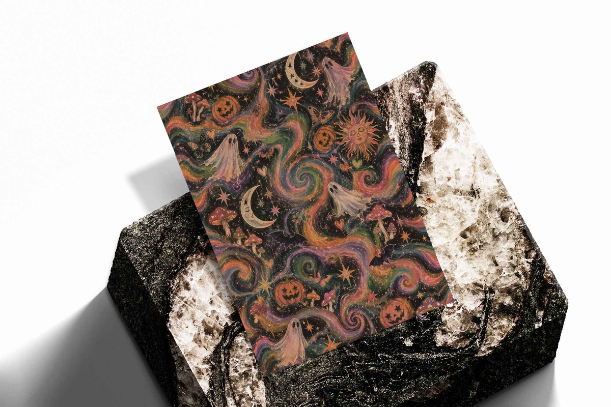 Halloween poster print stacked with ghost, pumpkins, crescent moons, and swirling spiral motifs.