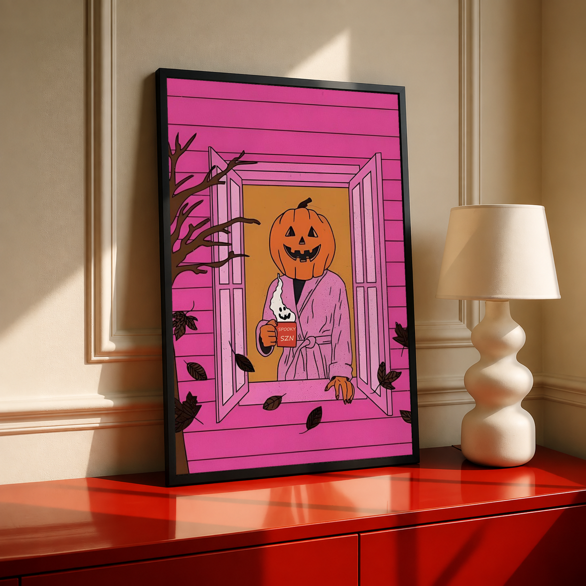 Black-framed Halloween poster showing jack-o'-lantern holding a drink and wearing a bathrobe