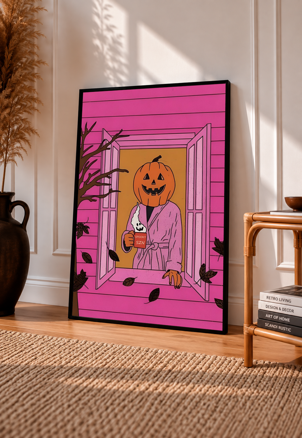 Halloween poster in black frame, pink window scene with jack-o'-lantern and ghost mug character