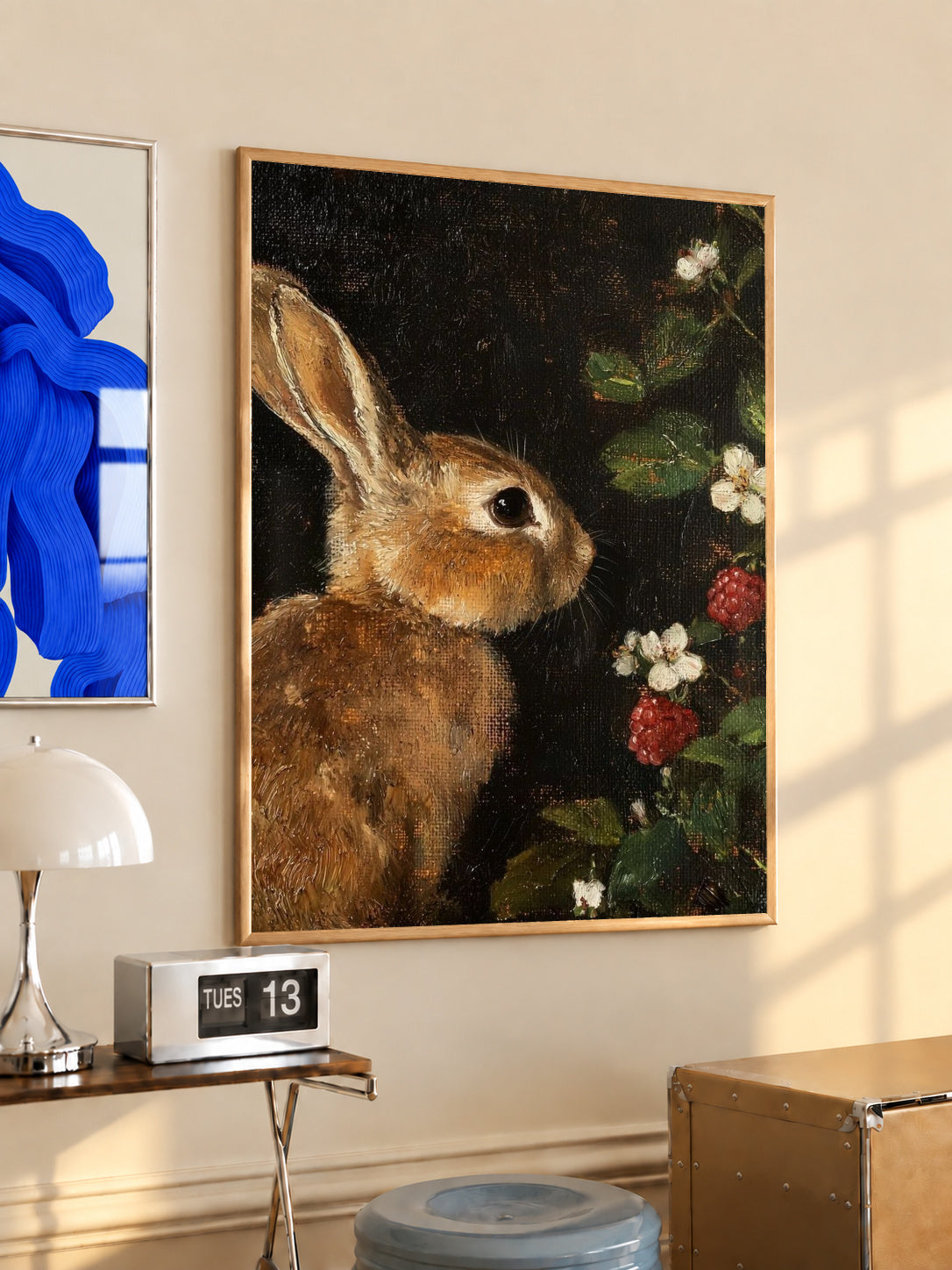 Wood-framed rabbit and botanical print on dark background, vertical wall art.