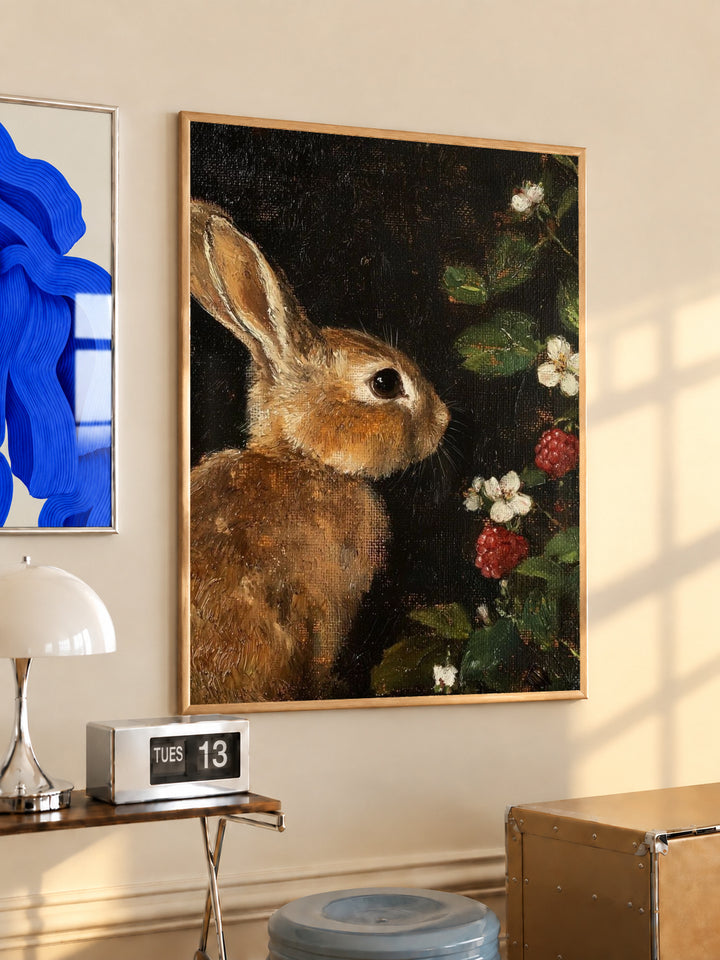Wood-framed rabbit and botanical print on dark background, vertical wall art.