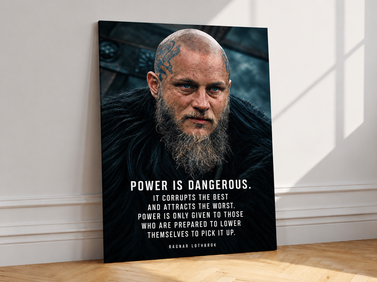 Ragnar Lothbrok quote wall art leaning against a pale wall on oak parquet flooring.