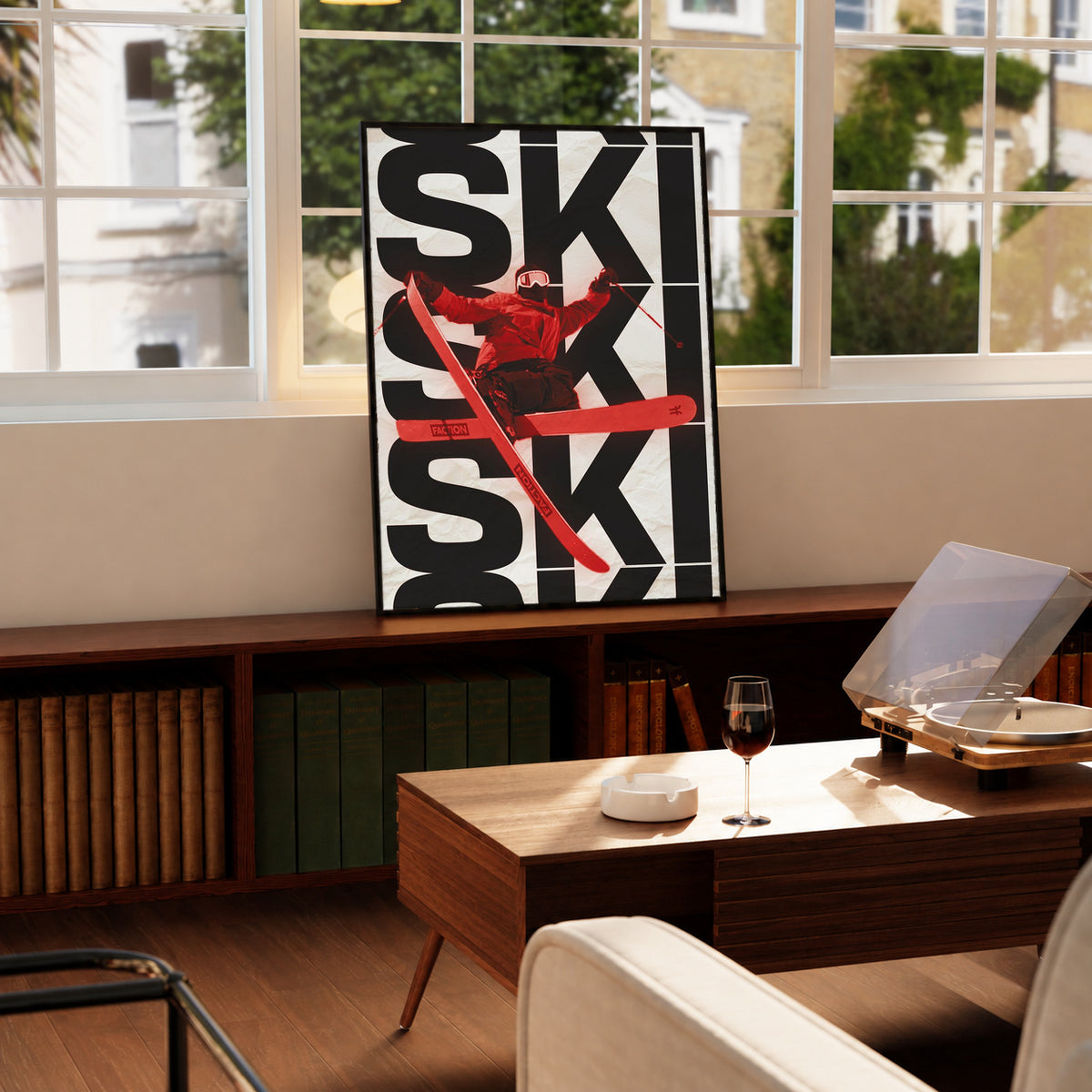 Ski poster in a frame with bold black SKI type and red skier silhouette