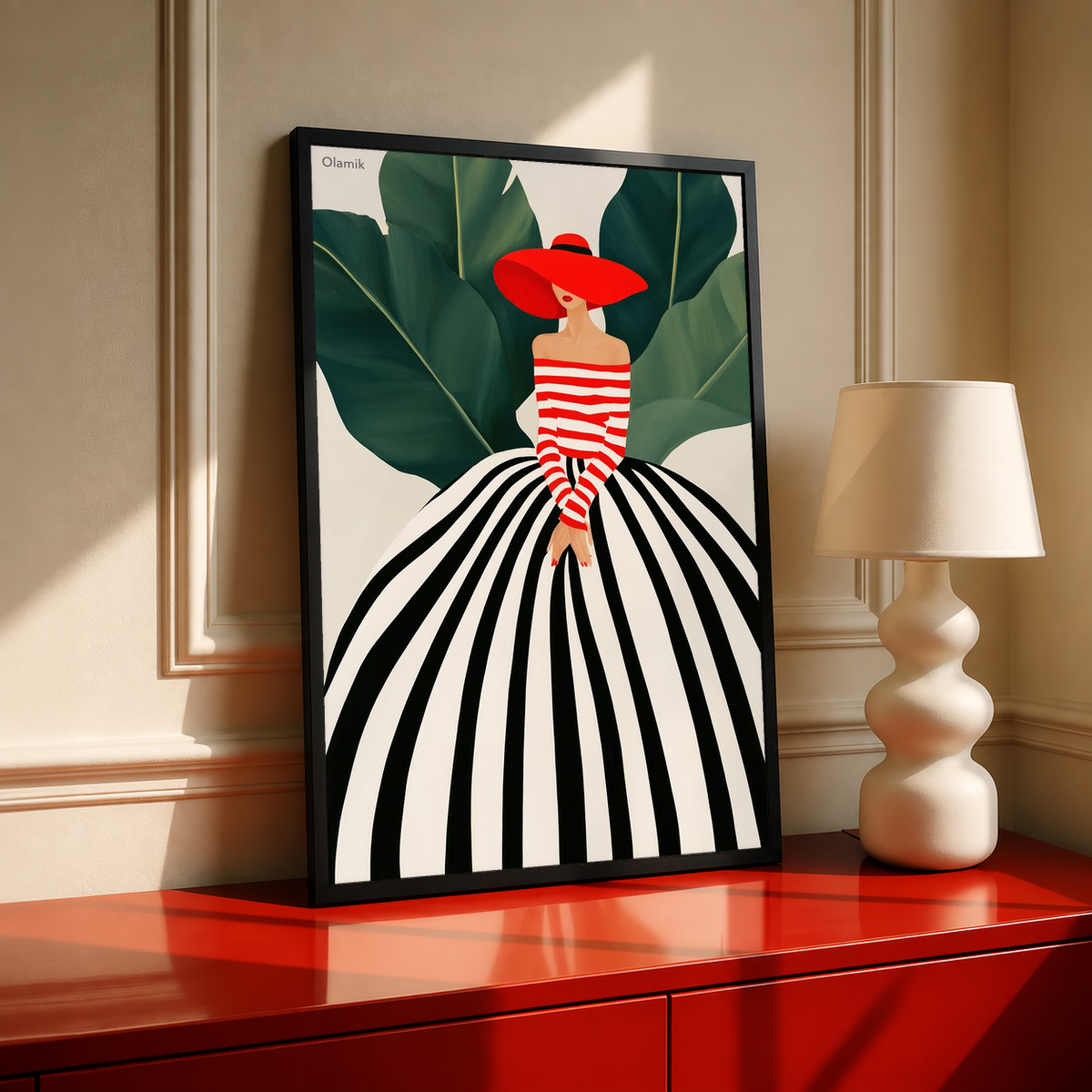 Framed portrait art print of red-hat woman in striped dress with green leaves, black frame.