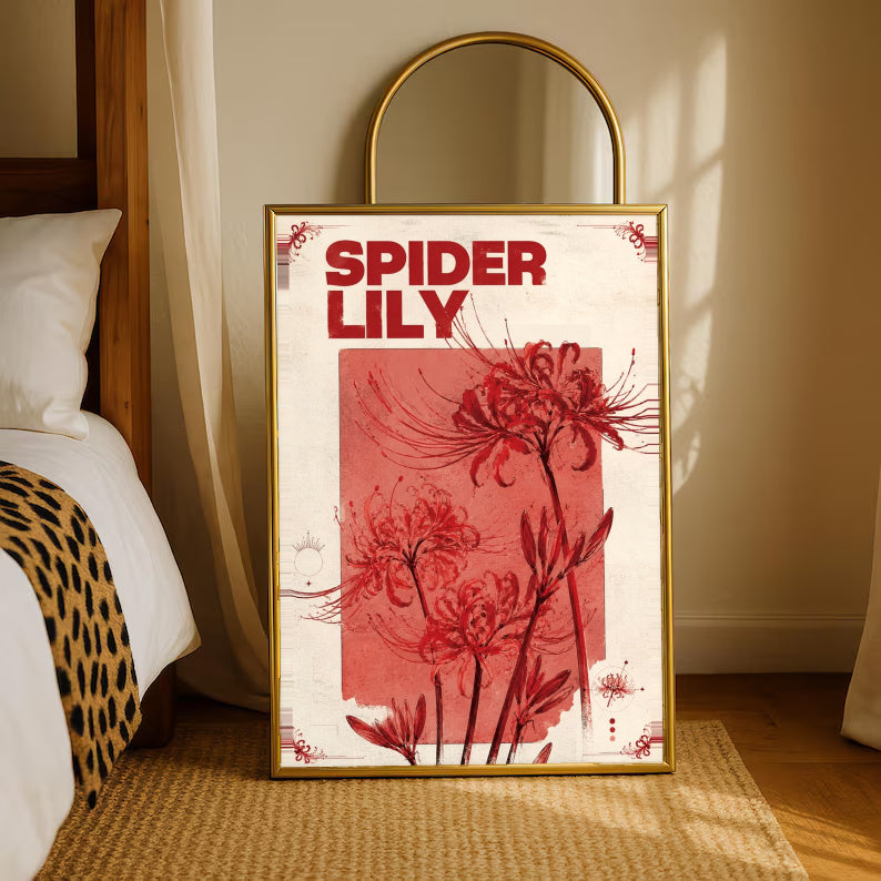 Red spider lily flowers and the words SPIDER LILY in a vintage cream and red botanical design in a gold-tone styling frame leaning beside a bedroom mirror